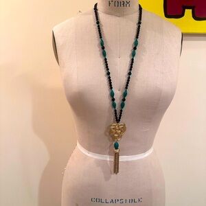 Long necklace- lots of detail.